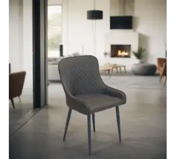 Modern dark gray chair with diamond-tufted back for rent | Estajer