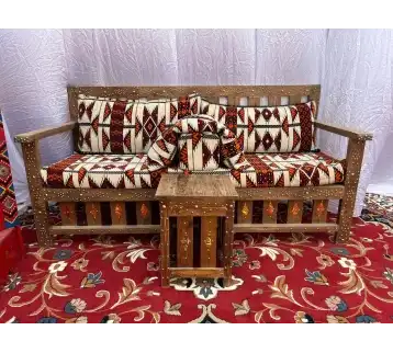 Wooden Arabic Majlis with a small wooden serving table for rent | Estajer